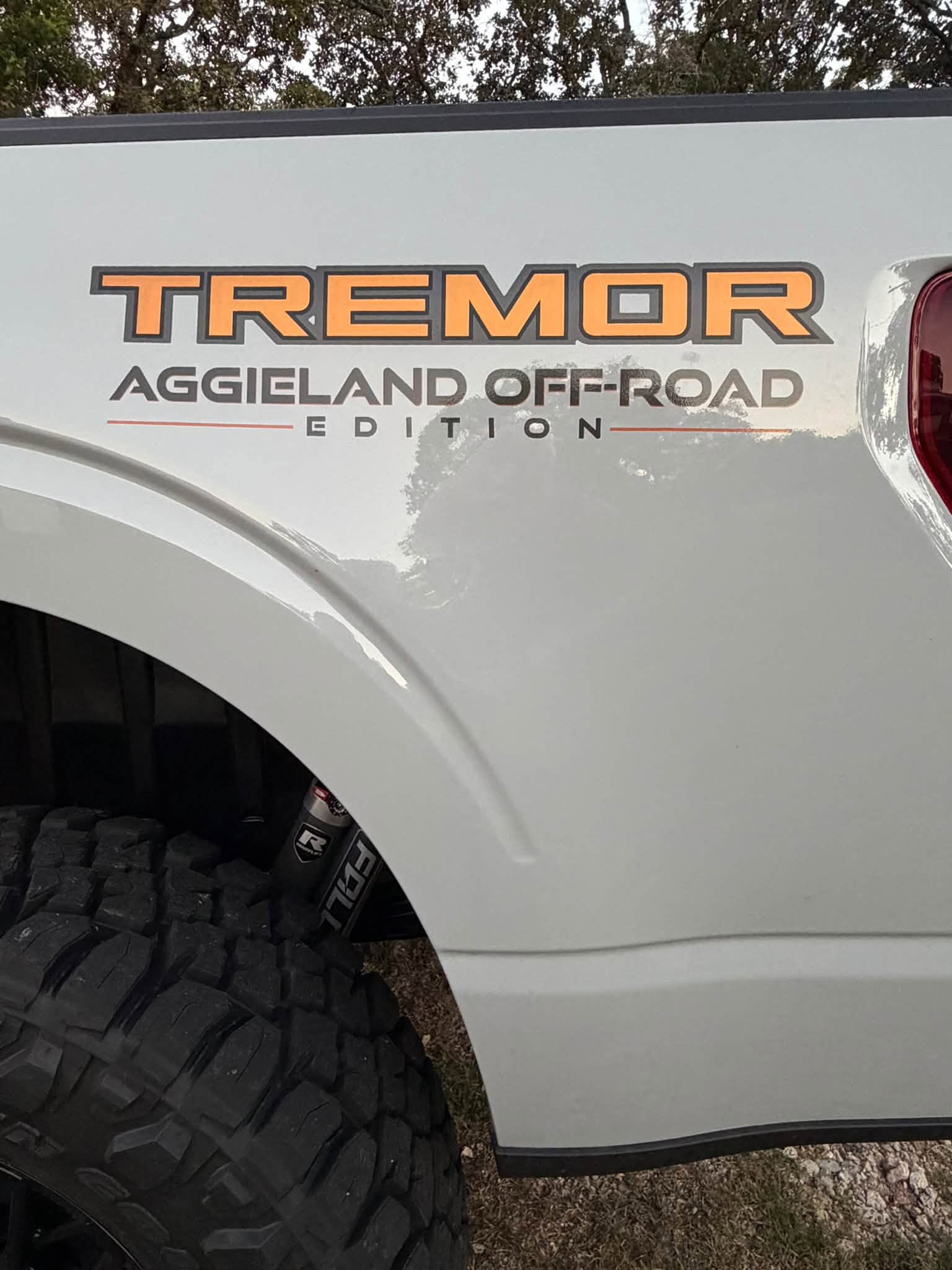Tremor Aggieland Off-Road Edition graphics on the bed side.